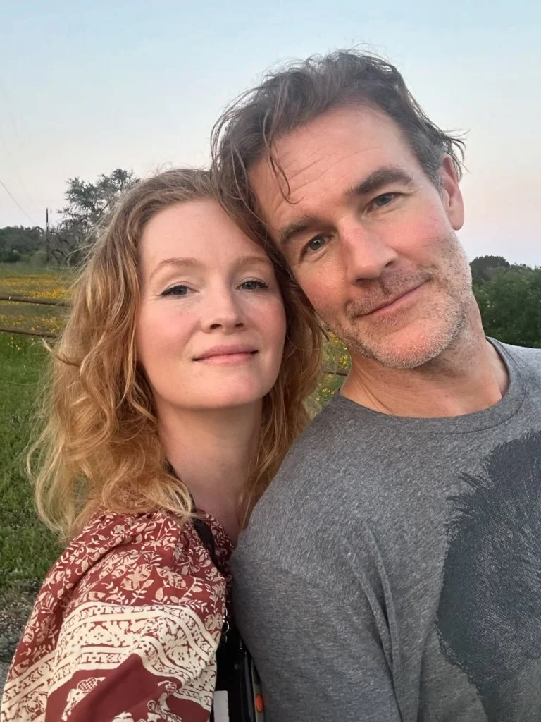 A man and a woman posing for a selfie.