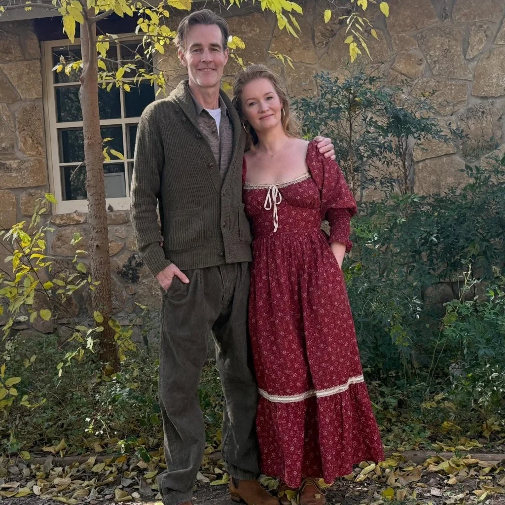 James and Kimberly Van Der Beek posing for a picture outdoors.