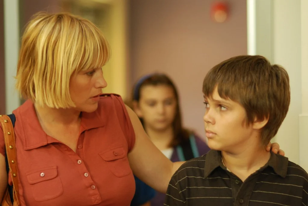 Patricia Arquette with her hand on Ellar Coltrane's shoulder in "Boyhood."