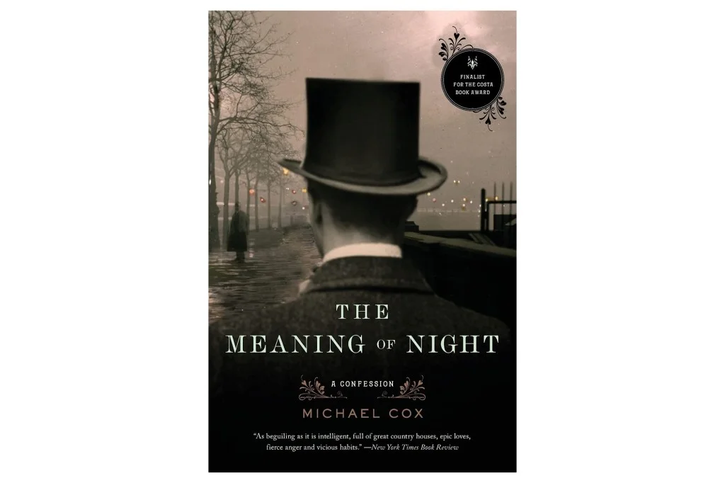 Book cover for "The Meaning of Night" by Michael Cox, featuring a man in a top hat looking over a dimly lit, possibly wet, path at night, with bare trees and a distant figure.