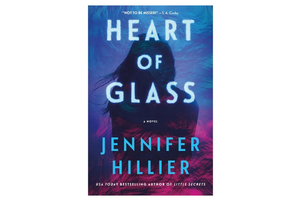 Book cover for "Heart of Glass" by Jennifer Hillier, showing "Heart of Glass" glowing on a dark, silhouetted figure, with Hillier's name below.