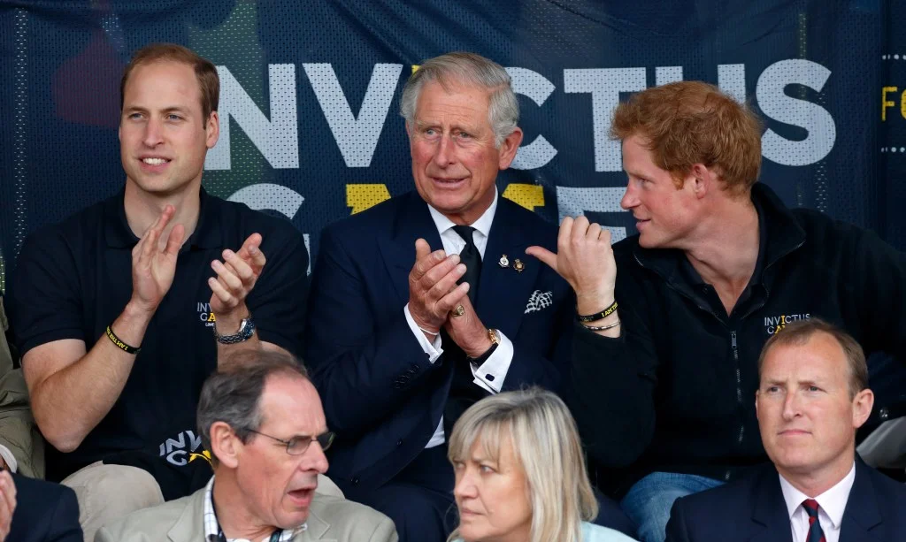 Prince William, Prince Charles, and Prince Harry watch athletics at the Invictus Games.