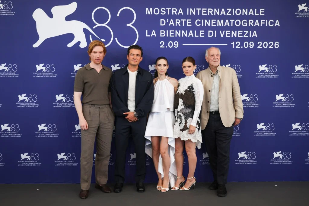 Domhnall Gleeson, Orlando Bloom, Rooney Mara, Kate Mara, and Werner Herzog pose at the "Bucking Fastard" photocall at the Venice Film Festival.