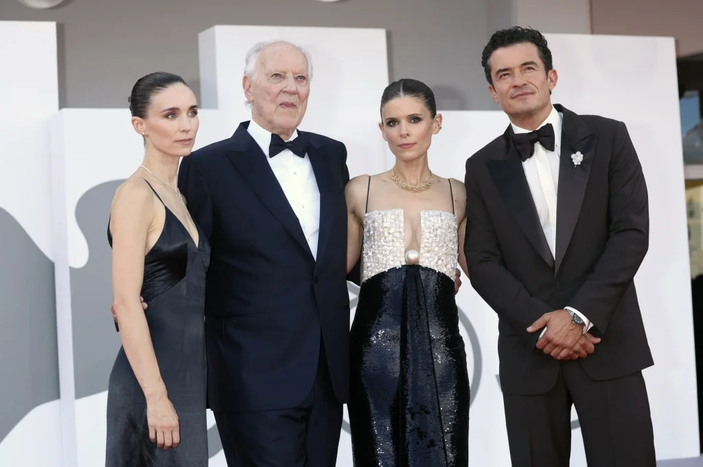 Rooney Mara, Werner Herzog, Kate Mara, and Orlando Bloom posing together at the "Bucking Fastard" premiere.