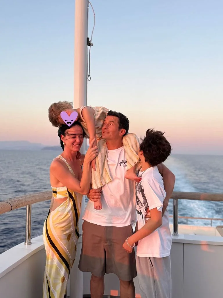 Katy Perry, Orlando Bloom, and their daughter Daisy on a boat.