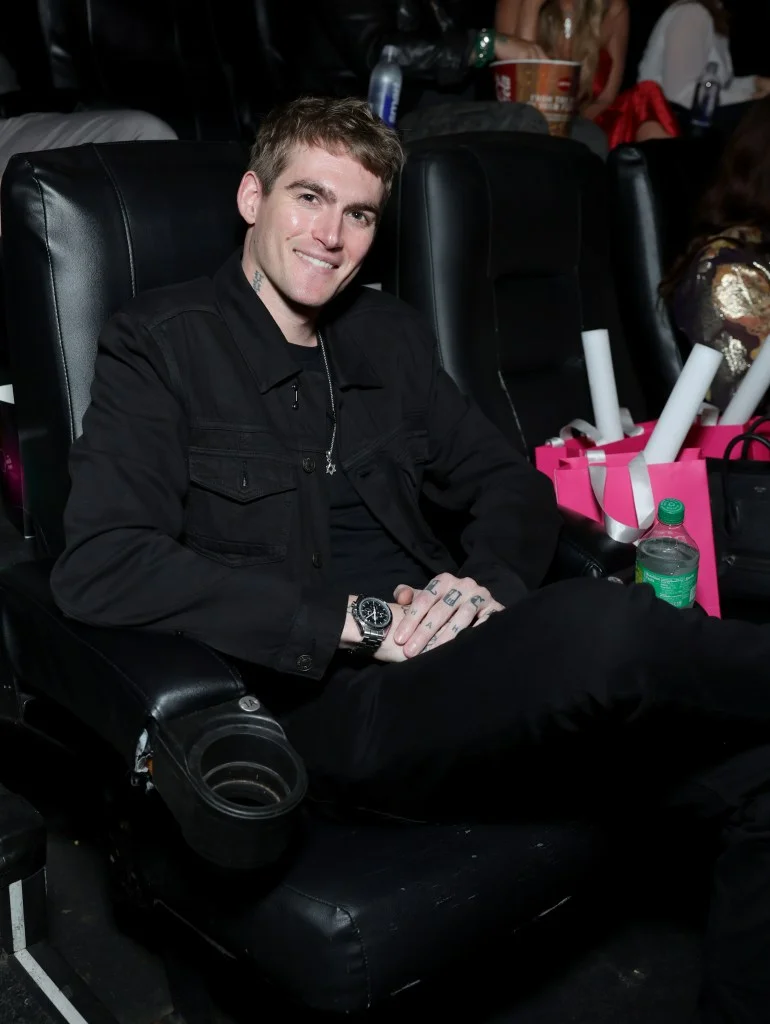 Presley Gerber sitting in a movie theater seat.
